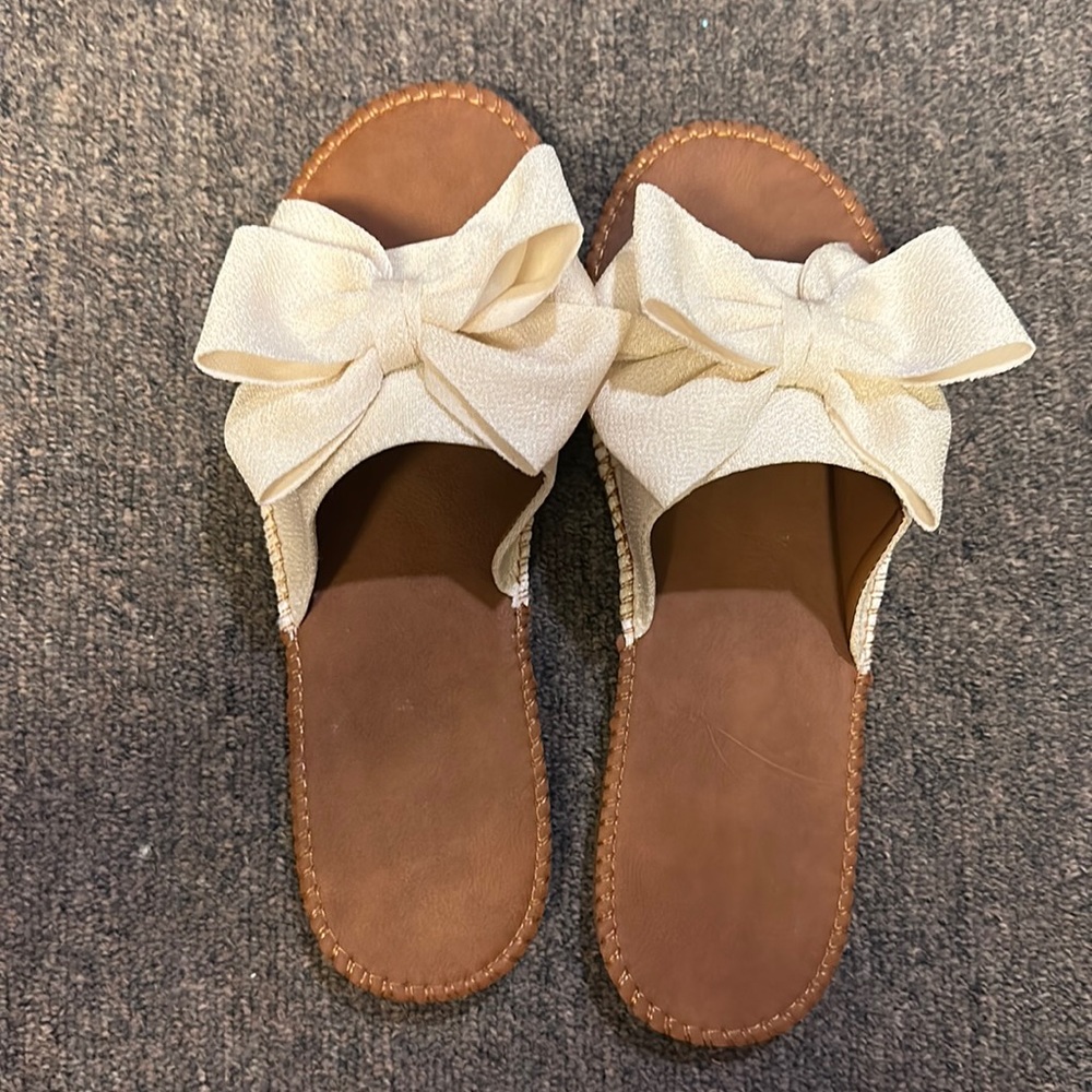 Sandals with white bow. Never worn. Size 9.